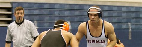 Powerful and Aggressive: Newman Wrestling Dominates the Mat